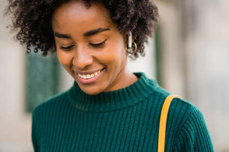 Portrait of afro business woman outdoors on the street.の写真素材