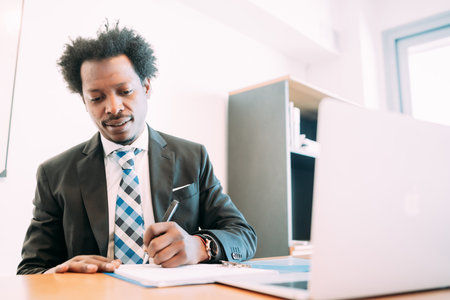 Businessman working with some files at office.