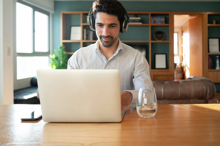 Man on a work video call from home.の写真素材