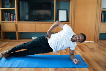 Man doing exercise at home.の写真素材