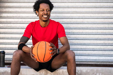 Afro athlete man relaxing after training.の写真素材