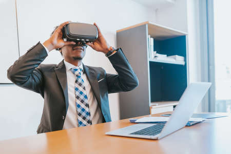 Businessman using virtual reality headsetの写真素材