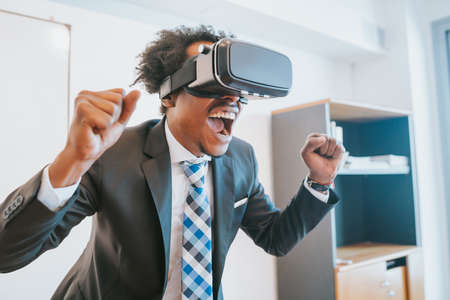 Businessman using virtual reality headsetの写真素材