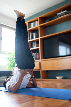Man doing exercise at home.の写真素材