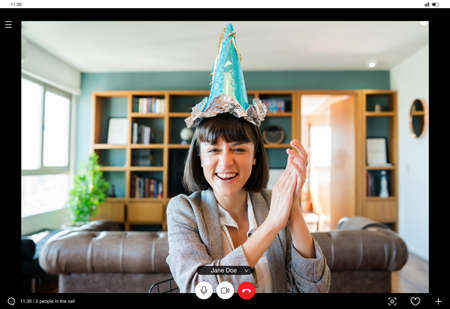 Woman celebrating her birthday online at home.の写真素材