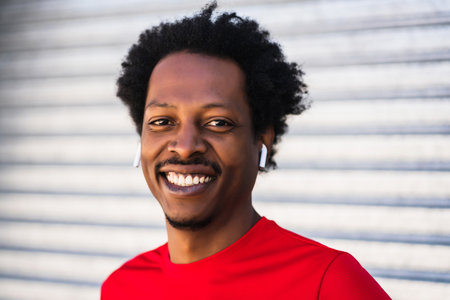 Afro athlete man standing outdoors.
