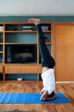 Man doing exercise at home.の写真素材