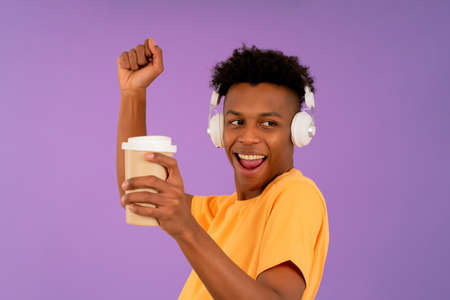 Young man listening music with headphones.の写真素材
