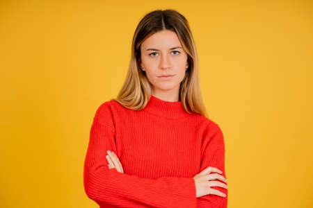 Portrait of a young woman with serious expression on her face.
