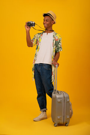 Young tourist man taking photos with camera.の写真素材
