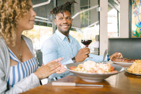 Couple having a lunch date at a restaurant.の写真素材
