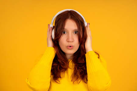 Young woman listening music with headphones.の写真素材