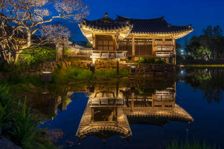Seochulji pond and Arakdang Pavilion, traditional korean house at night. Hanok village over pond at night in Gyeongju - South Korea.のeditorial素材