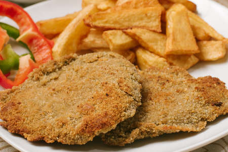 Argentine Milanesa with fried potatoes