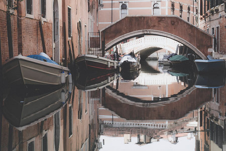 bridge with some boats near a bridgeの写真素材