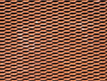 rusty geometrical grate. orange, brown texture