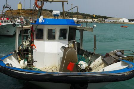 Andalusia, Spain, April 23, 2017: Dirty and messy fishing boat on the spanish coast near Conil de la fronteraのeditorial素材