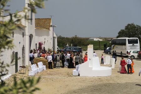 2017, April 22, Andalusia: traditional wedding in a spanish village, people wearing beautiful colored flamenco style dressesのeditorial素材