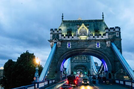 2019 june 2, London, The beautiful ancient tower bridge of london on a foggy and rainy night in great britain with many cars and traffic lightsのeditorial素材