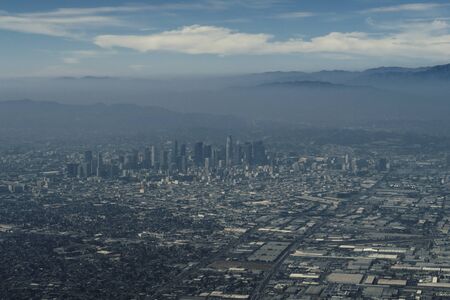 Panoramic view of the high buildings of LA Downtown during the flight while getting closer to the airportの写真素材