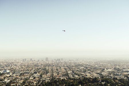 Panoramic view of the high buildings of LA Downtown during the flight while getting closer to the...