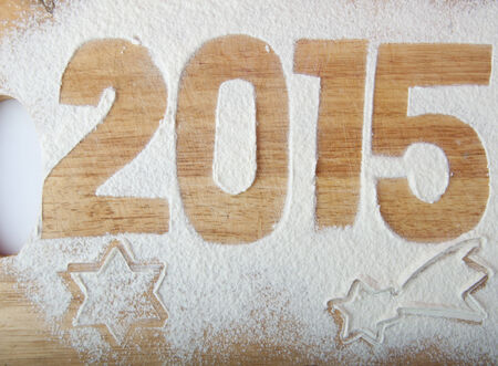 Decorative registration inscription 2015 made of flour on a wooden cutting boardの写真素材