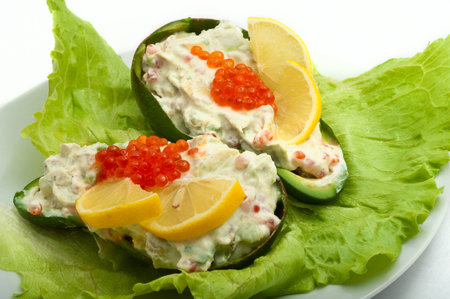 red caviar with avocado salad in a plate on white backgroundの写真素材