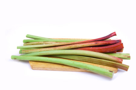 rhubarb stalks on a cutting boardの写真素材