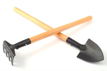 garden spade and rake separately on a white backgroundの写真素材
