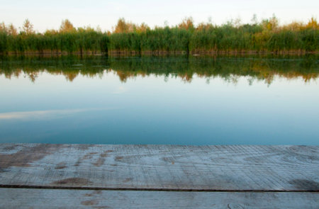 river pier in a landscape sunset