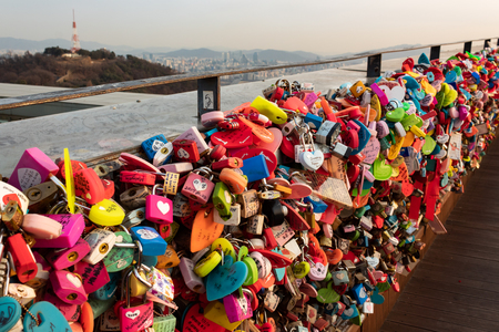 SEOUL, SOUTH KOREA - JAN 22, 2018: Padlocks left from couples that visited the N Seoul Tower at sunset, love conceptのeditorial素材