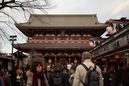 TOKYO, JAPAN - 13 FEB 2018: People walking down a path at Senso-ji Shrine with traditional shops on both sides and Temple Gate at backgroundのeditorial素材