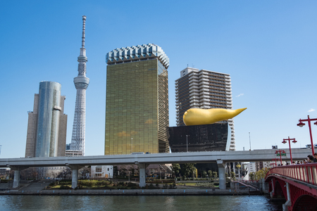 TOKYO, JAPAN - 13 FEB 2018: Asakusa skyline with Tokyo Sky Tree and Asahi super dry building and Sumida River at daytimeのeditorial素材