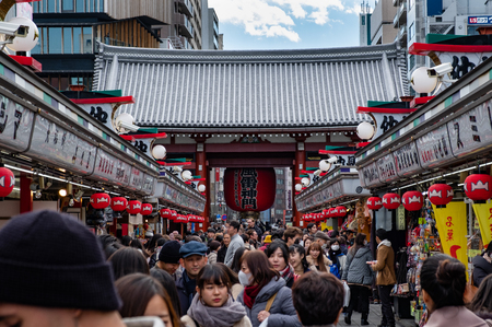 TOKYO, JAPAN - 13 FEB 2018: Tourists and locals walking in Senso-ji temple market street facing to the lanternt at the entranceのeditorial素材