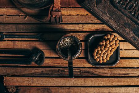 Argentine mate and cookies on wood. Style with vintage decoration of rusty metals and leather.の写真素材