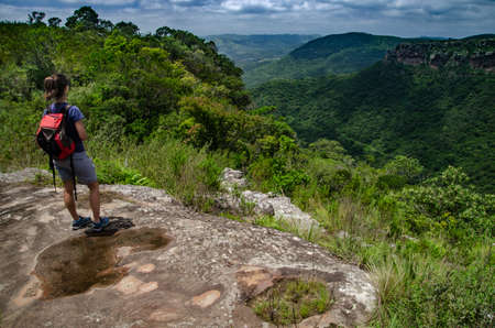 Girl beholding the magnificent landscapeの写真素材