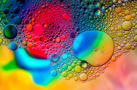 Colorful background out of focus with a pattern of bubbles at the front. The texture and colors comes from aquatic animals.の写真素材