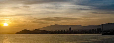 Panoramic view of the skyline of Benidorm at sunsetの写真素材