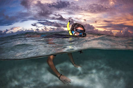 Snorkeling at Sunset in the crystal clear waters of Maldives