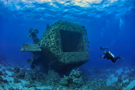 Two divers eploring the outside of the famous wreck in Safaga Salem Expressの写真素材