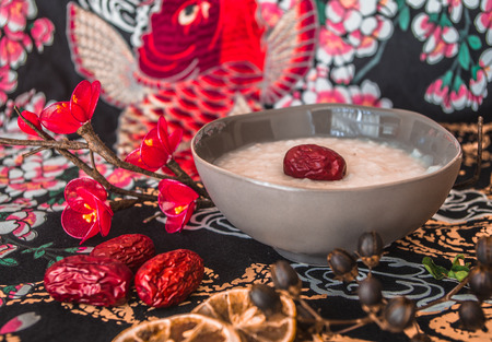 Chinese breakfast rice congee with red date toppingの写真素材