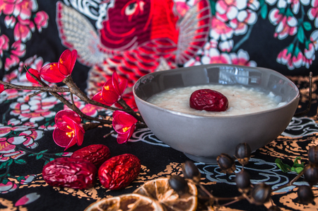 Chinese breakfast rice congee with red datesの写真素材