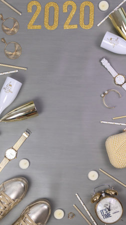 jewellery champagne flutes a clock and the numbers 2020の写真素材