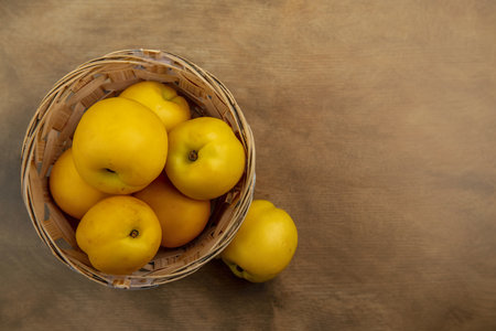 top view of apples in basket and on wooden background with copy spaceの写真素材