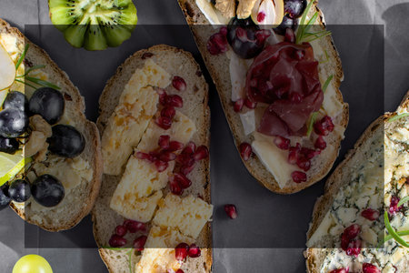 Cheese platter and bread sandwiches with copy spaceの写真素材