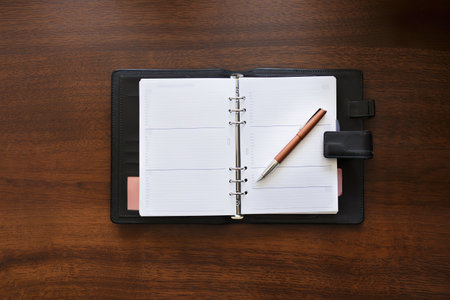 Blank planner on wooden desk