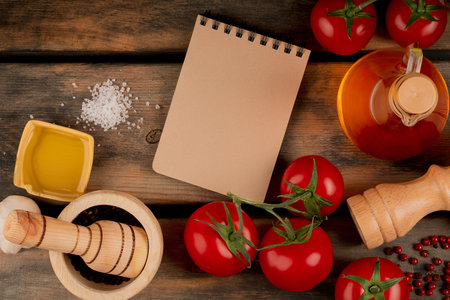 top view of spaghetti pasta with black pepper seeds tomatoes pepper salt and melted butterの写真素材
