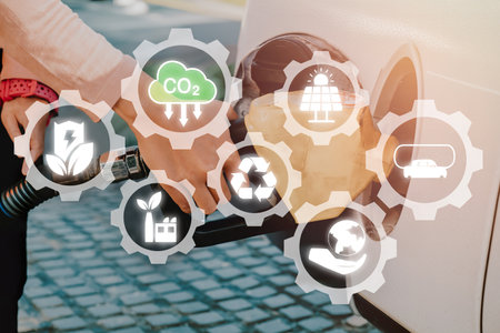 Reduce CO emission concept, Person Handle pumping gasoline fuel nozzle to refuelの写真素材