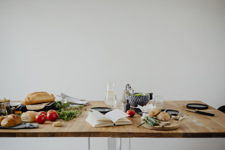 Messy dining table with a book