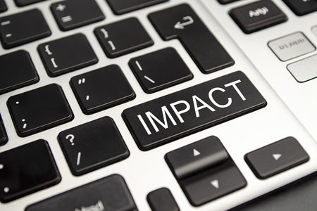 Impact button on keyboard - business conceptの写真素材